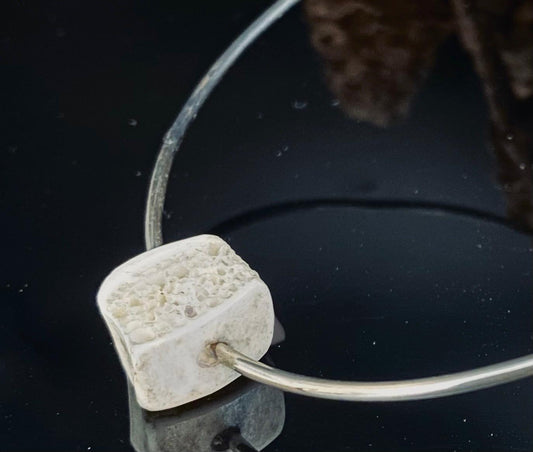 Terra Bangle with Trabecular Bone Charm